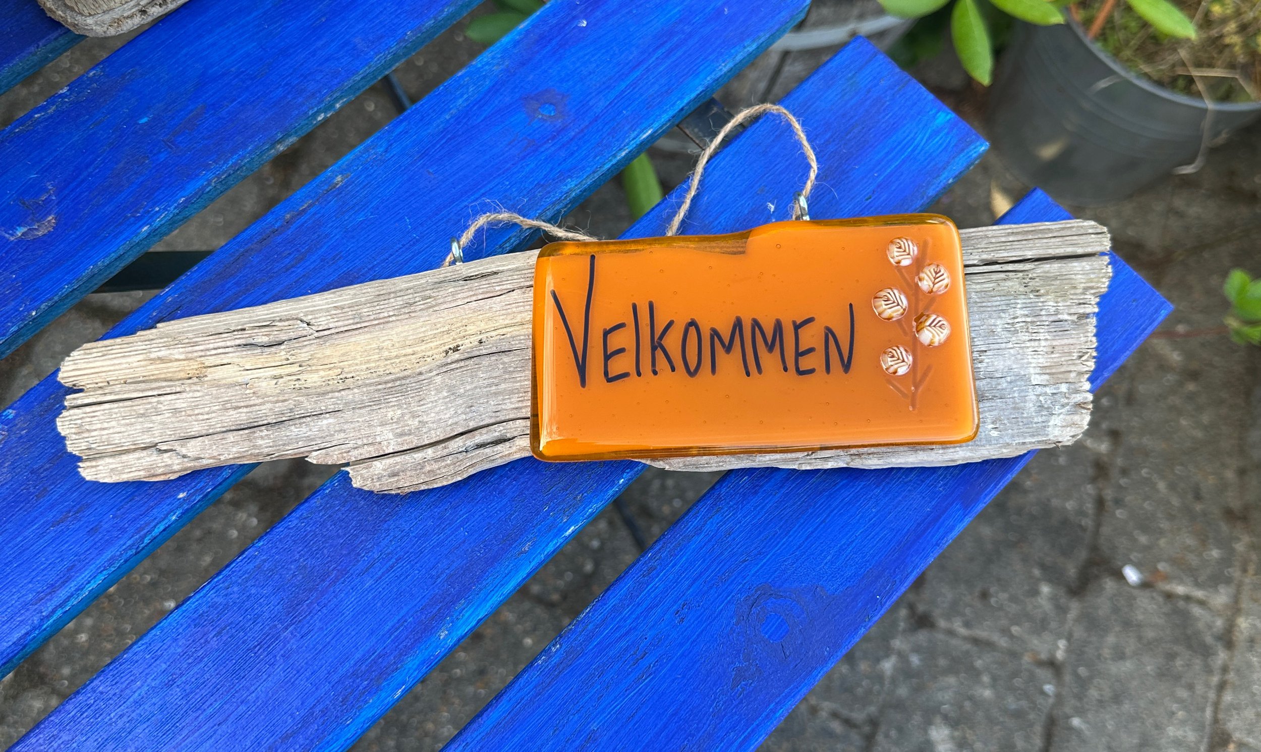Orange velkommen skilt med blade